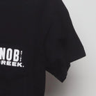 Close-up of the Right sleeve on the Vintage Y2K Knob Creek "Every Bit Earned" T-Shirt - XS