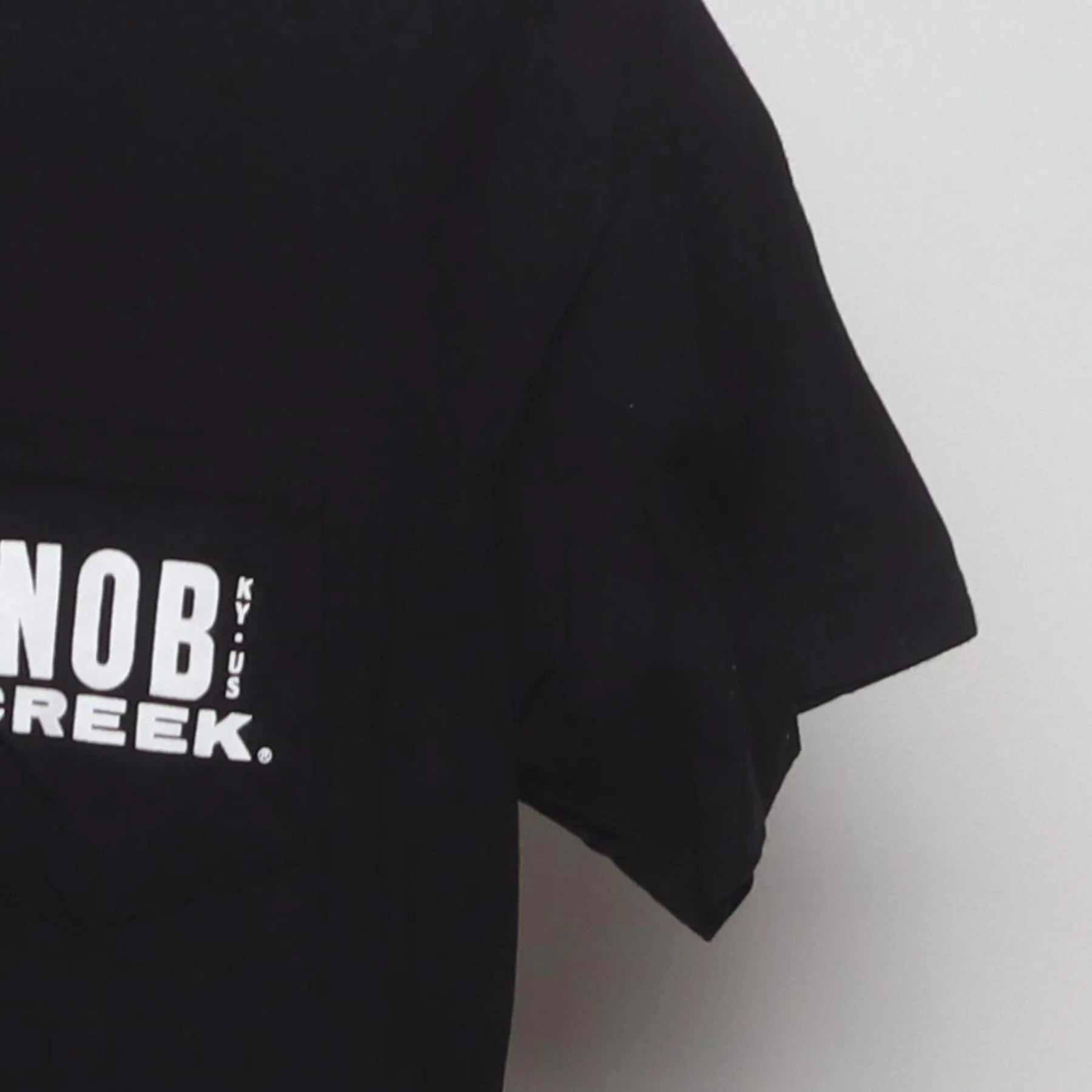 Close-up of the Right sleeve on the Vintage Y2K Knob Creek "Every Bit Earned" T-Shirt - XS