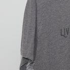 Close-up of the Left sleeve on the Vintage Y2K Live The Adventure "Bicycle Graphic" T-Shirt - M