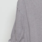 Close-up of the sleeve on the Vintage Modern Elf Movie "Need Hugs" T-Shirt - XXL