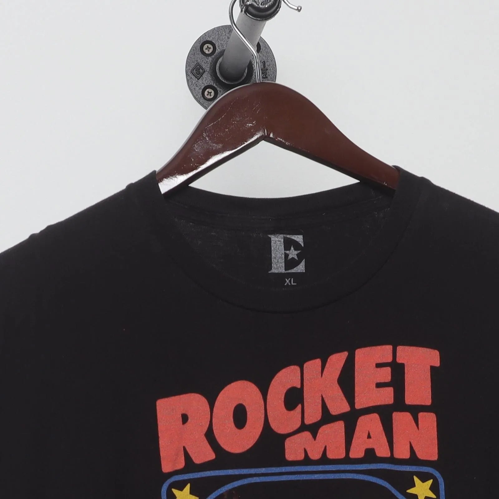 Close-up of the collar and tag on the Vintage Modern Elton John "Rocket Man" T-Shirt - L