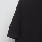 Close-up of the sleeve on the Vintage Modern Elton John "Rocket Man" T-Shirt - L