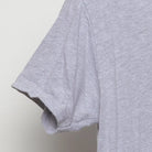 Close-up of the sleeve on the Vintage Modern Englewood Grass Farm "Cycling Cow" T-Shirt - M