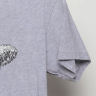 Close-up of the sleeve on the Vintage Modern Englewood Grass Farm "Cycling Cow" T-Shirt - M