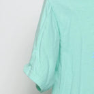 Close-up of the sleeve on the Vintage Modern HK "Found In Paradise" T-Shirt - S