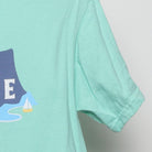 Close-up of the sleeve on the Vintage Modern HK "Found In Paradise" T-Shirt - S