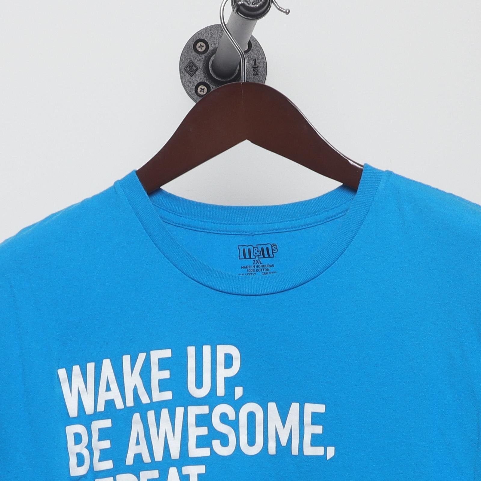 Close-up of the collar and tag on the Vintage Modern M&M's "Wake Up. Be Awesome. Repeat." T-Shirt - XL