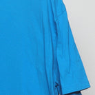 Close-up of the sleeve on the Vintage Modern M&M's "Wake Up. Be Awesome. Repeat." T-Shirt - XL