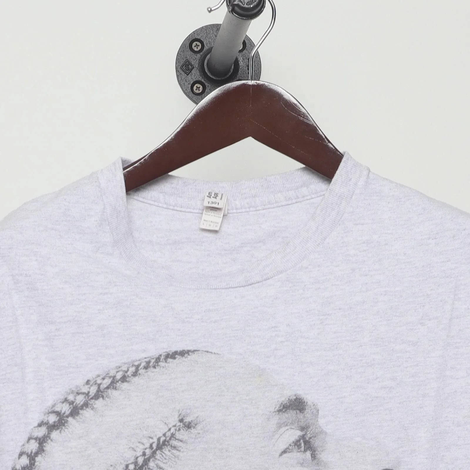 Close-up of the collar and tag on the Vintage Modern Nipsey Hussle "Never Let A Hard Time Humble Us" T-Shirt - L