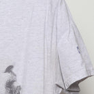 Close-up of the sleeve on the Vintage Modern Nipsey Hussle "Never Let A Hard Time Humble Us" T-Shirt - L