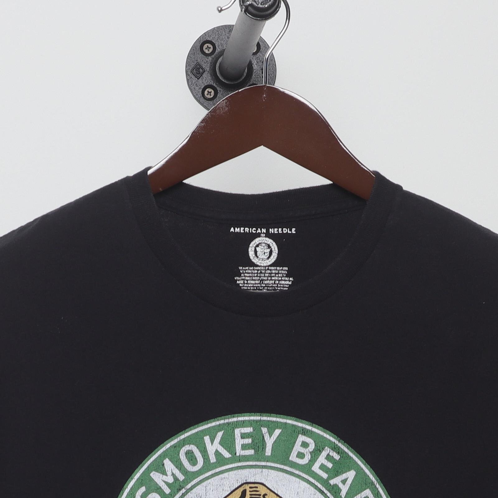 Close-up of the collar and tag on the Vintage Modern Smokey Bear "Only You Can Prevent Wildfires" T-Shirt - M
