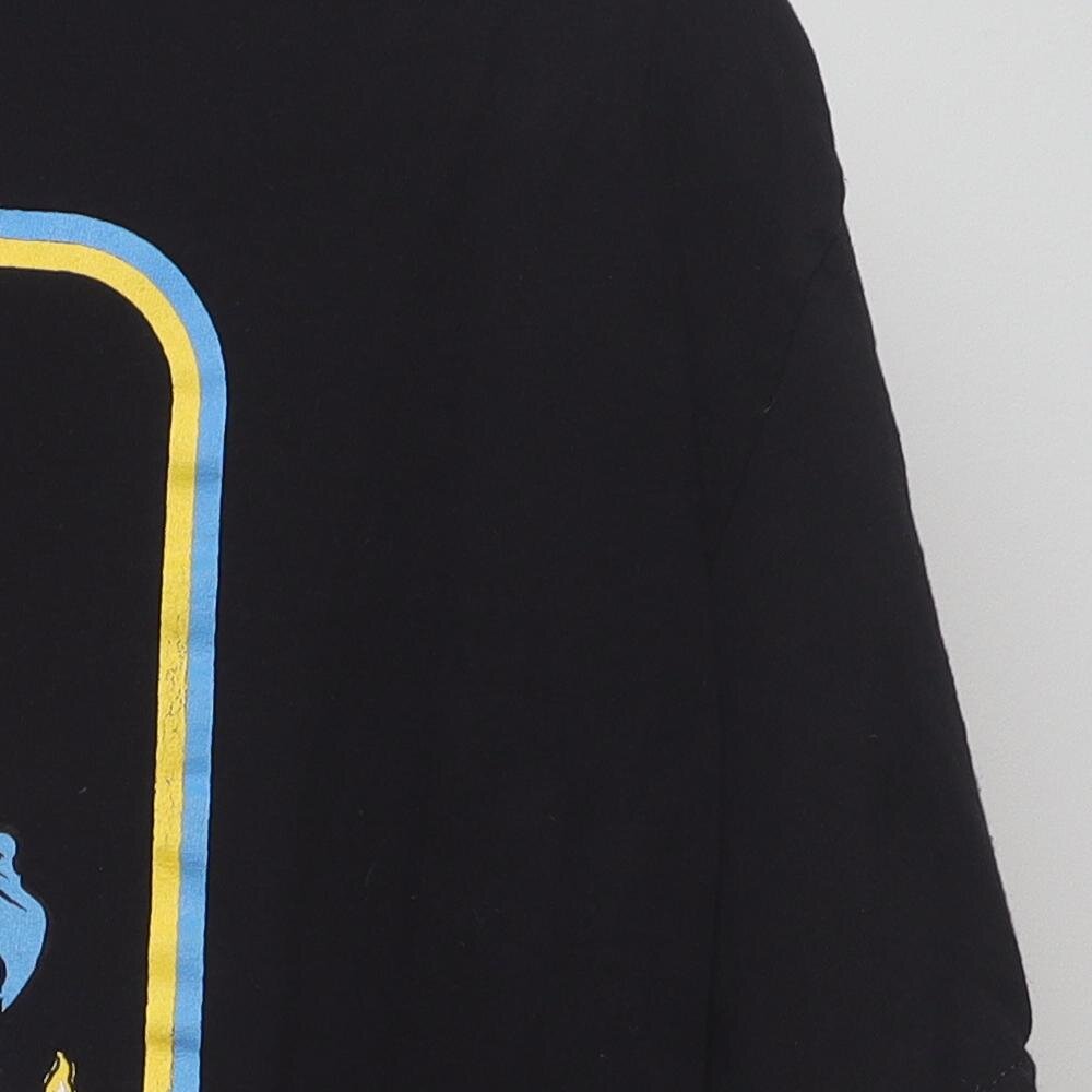 Close-up of the sleeve on the Vintage Modern Steven Rhodes "Caring for your Demon Cat" T-Shirt - L