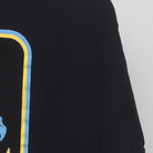 Close-up of the sleeve on the Vintage Modern Steven Rhodes "Caring for your Demon Cat" T-Shirt - L