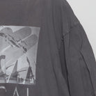 Close-up of the sleeve on the Vintage Modern Universal Studios "Photo Collage Graphic" T-Shirt - XL