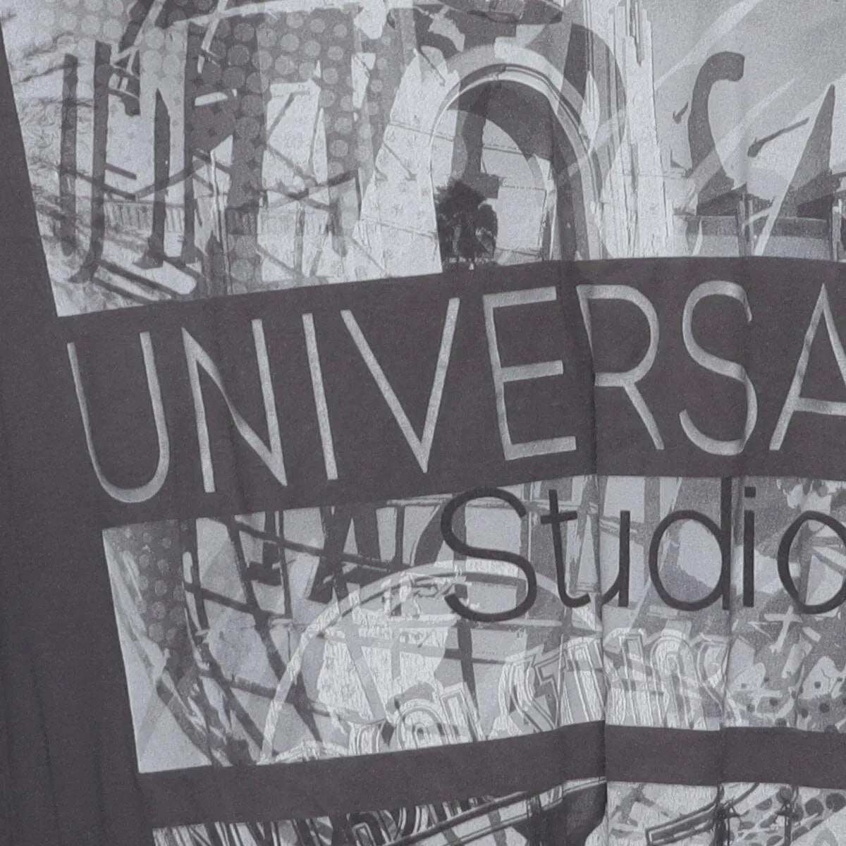 Close-up of the sleeve on the Vintage Modern Universal Studios "Photo Collage Graphic" T-Shirt - XL