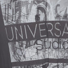 Close-up of the sleeve on the Vintage Modern Universal Studios "Photo Collage Graphic" T-Shirt - XL