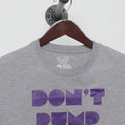 Close-up of the collar and tag on the Vintage 2000s Nike "Don't Pump Fake The Money Shot" T-Shirt - L