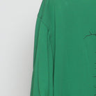 Close-up of the Left sleeve on the Vintage Y2K Nike "Cracked Shield Graphic" T-Shirt - XL