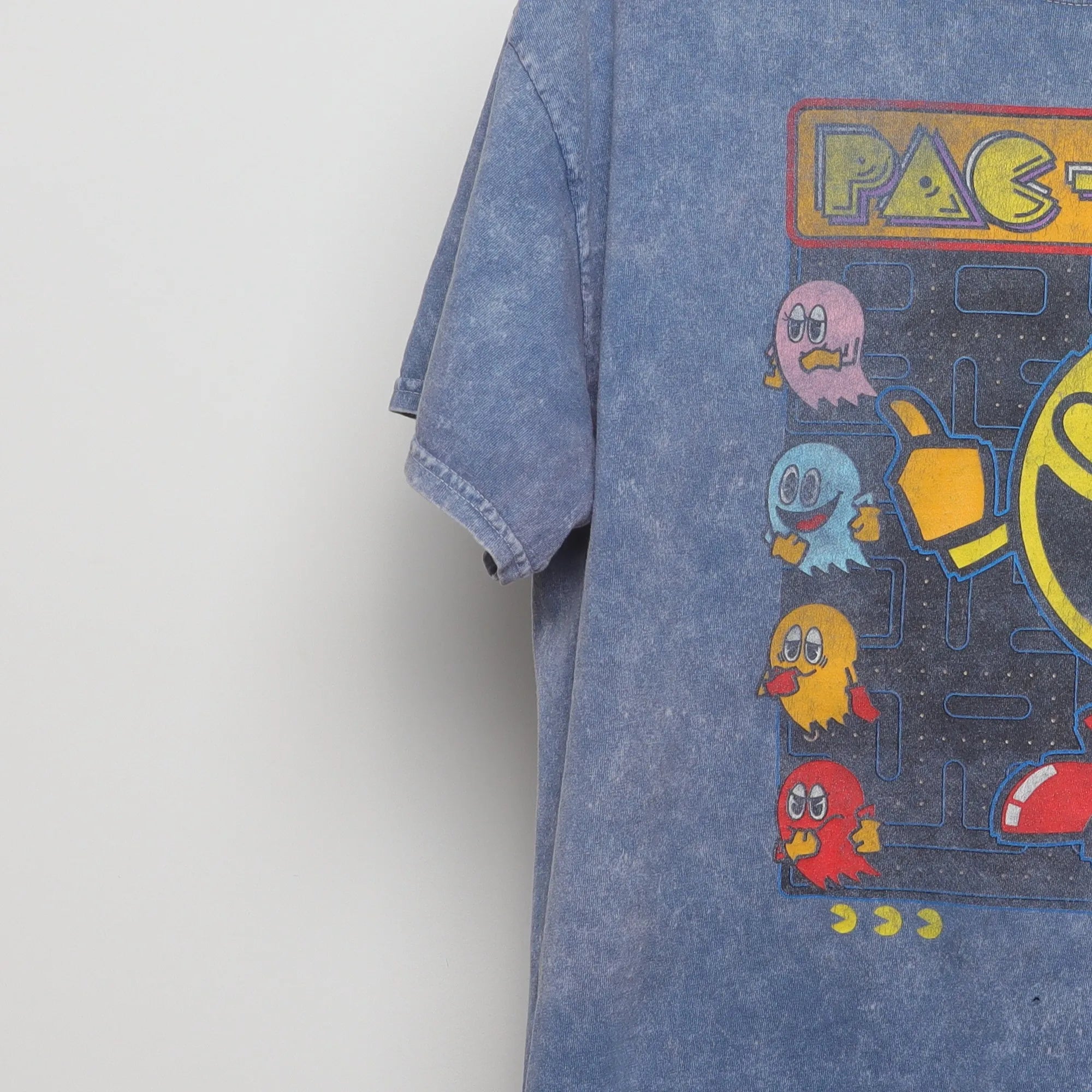 Close-up of the sleeve on the Vintage Pac-Man Acid Wash Video Game T-Shirt L