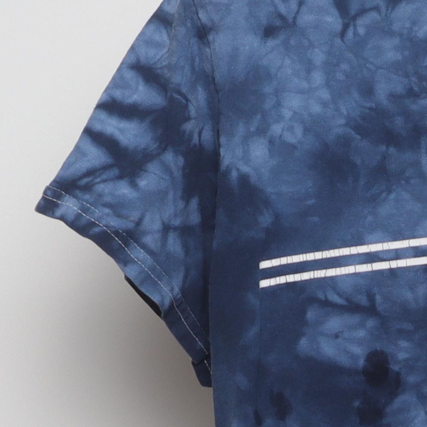 Close-up of the Left sleeve on the Vintage Y2K Santa Cruz Skateboards "Classic Dot Logo Tie-Dye" T-Shirt - S
