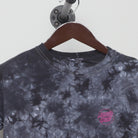 Close-up of the collar and tag on the Vintage Y2K Santa Cruz Skateboards "Multi-Logo Tie-Dye" T-Shirt - XS