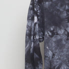 Close-up of the Left sleeve on the Vintage Y2K Santa Cruz Skateboards "Multi-Logo Tie-Dye" T-Shirt - XS