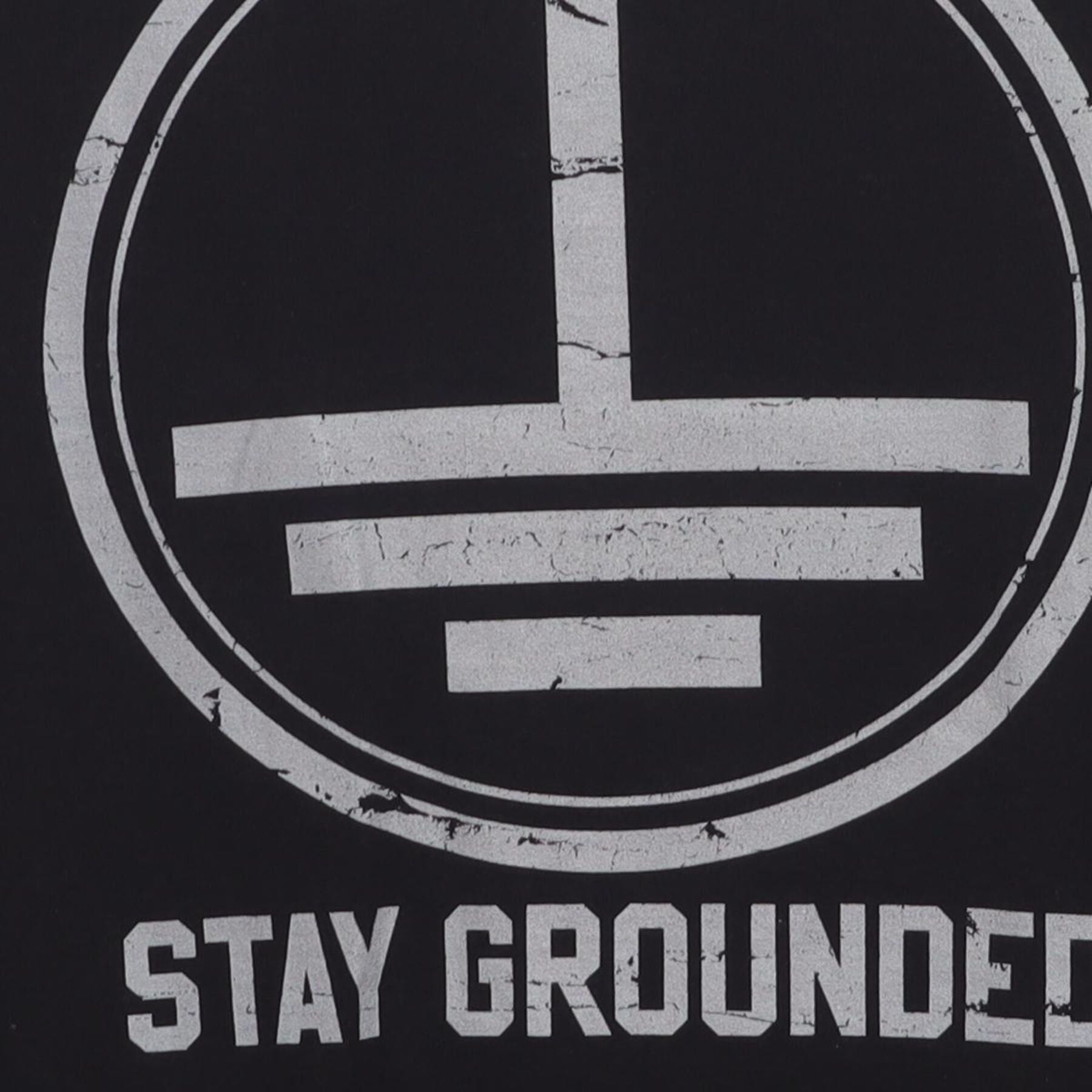 Close-up of the main graphic on the Vintage Y2K Graphic "Stay Grounded" T-Shirt - L
