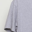 Close-up of the Left sleeve on the Vintage Y2K Steamboat "Chipped Teeth Ride On" T-Shirt - M