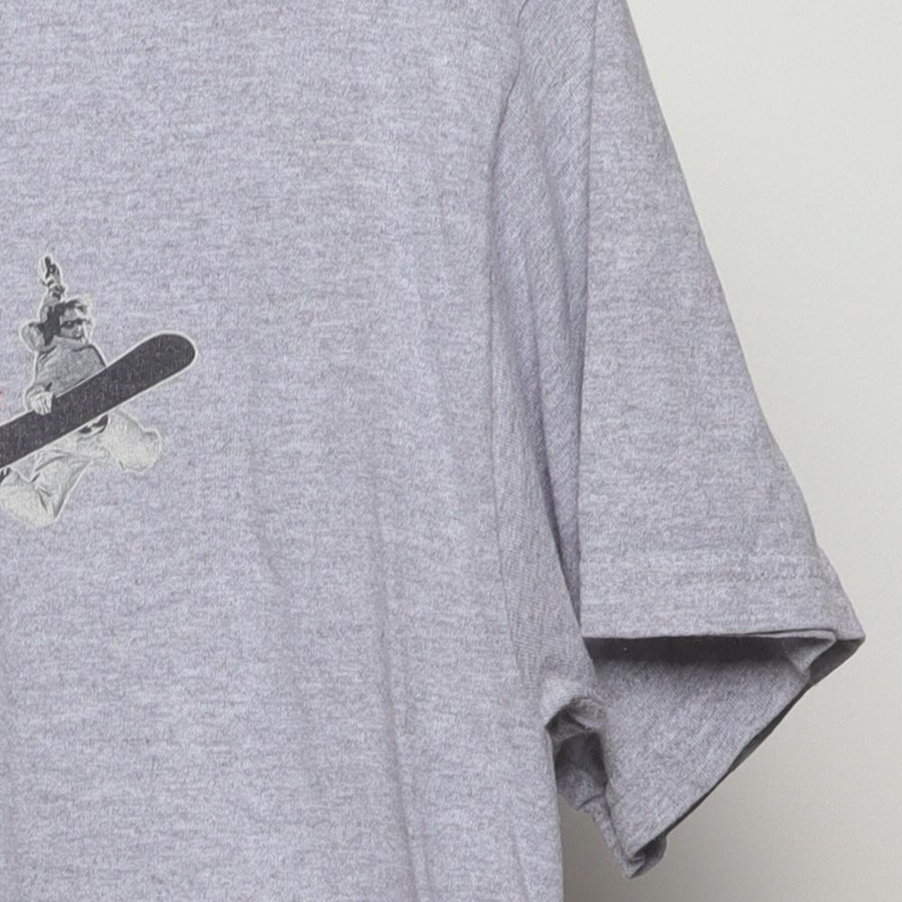 Close-up of the Right sleeve on the Vintage Y2K Steamboat "Chipped Teeth Ride On" T-Shirt - M