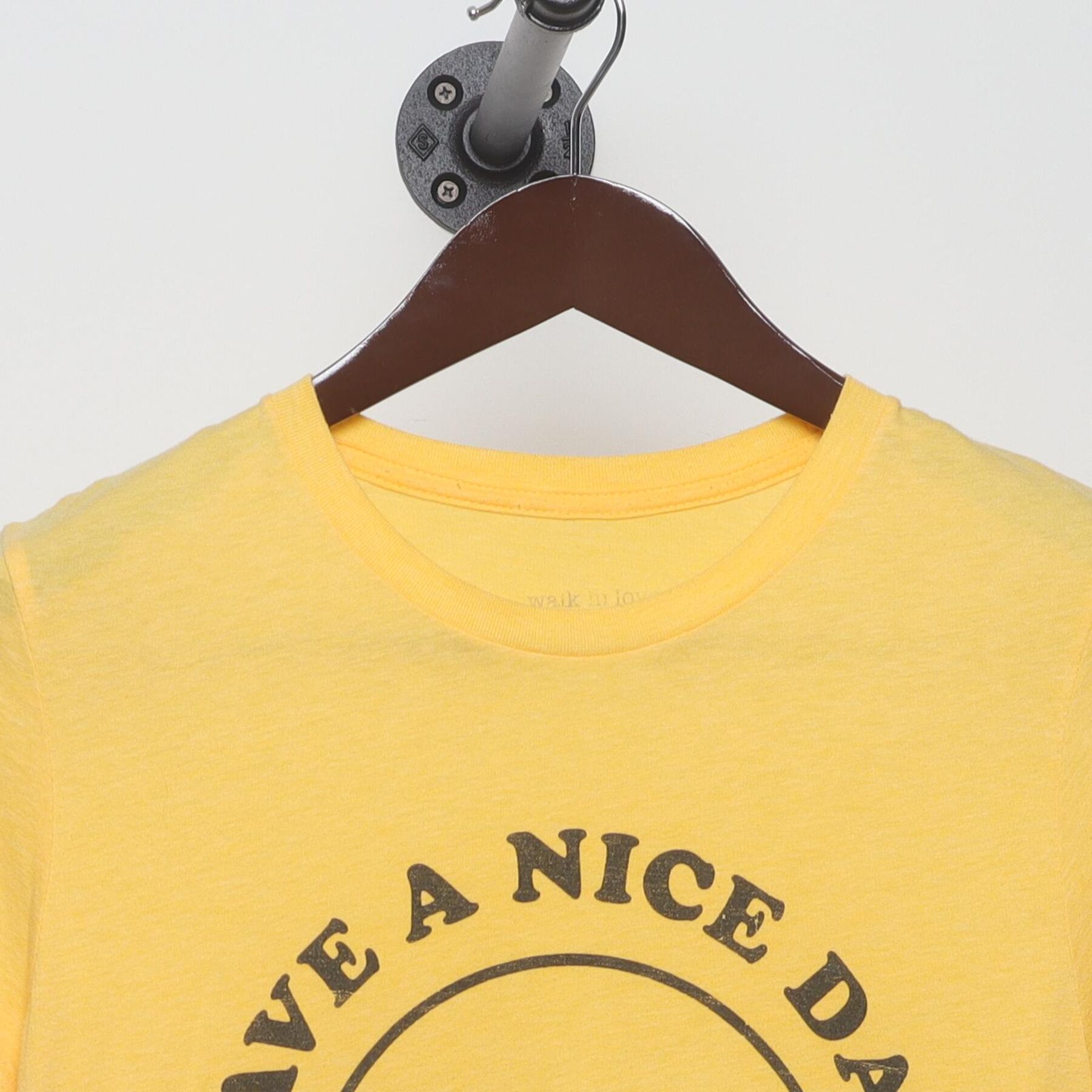 Close-up of the collar and tag on the Vintage 1970s walk in love. "Have A Nice Day" Smiley Face T-Shirt - XS