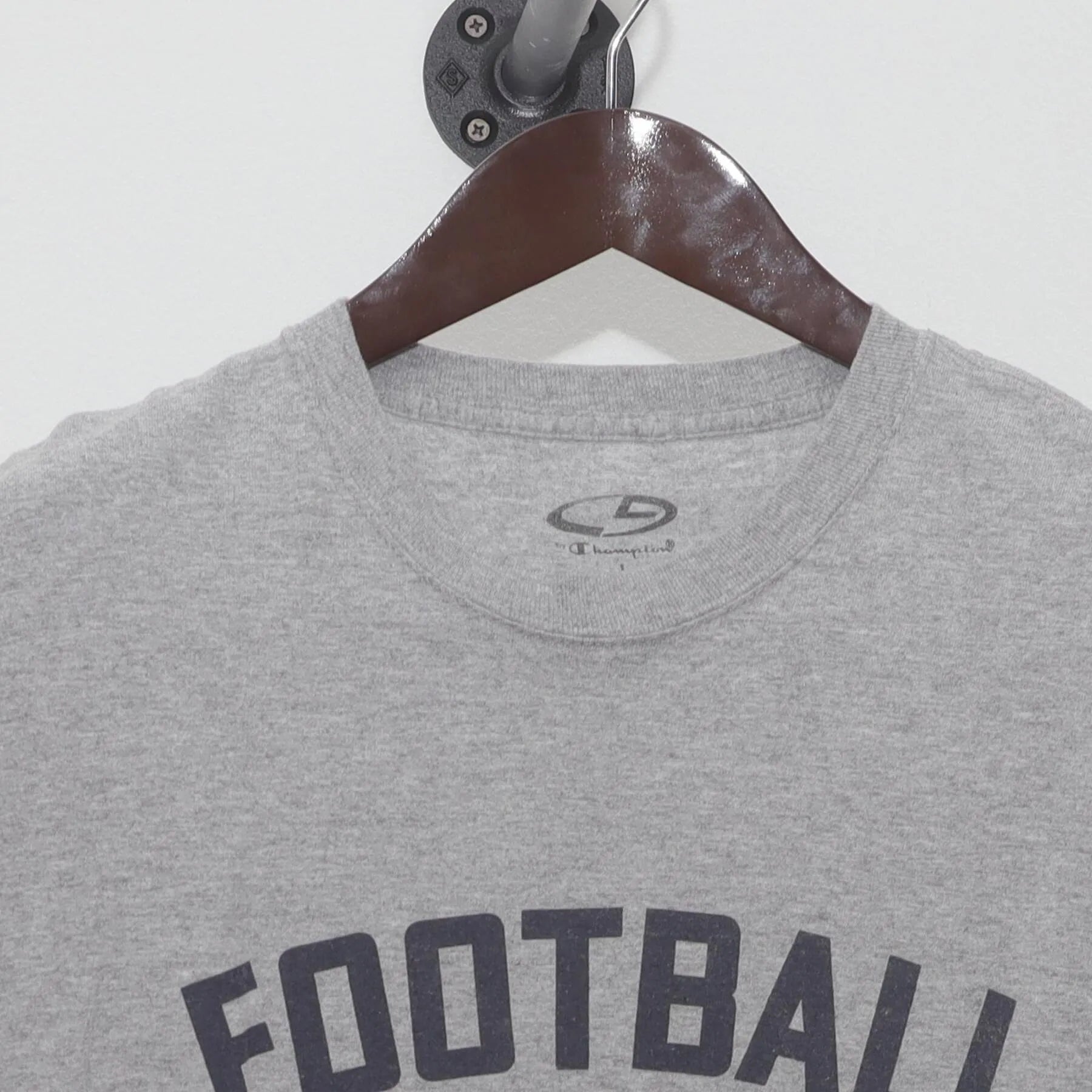 Close-up of the collar and tag on the Vintage Y2K Champion "Football" T-Shirt - M