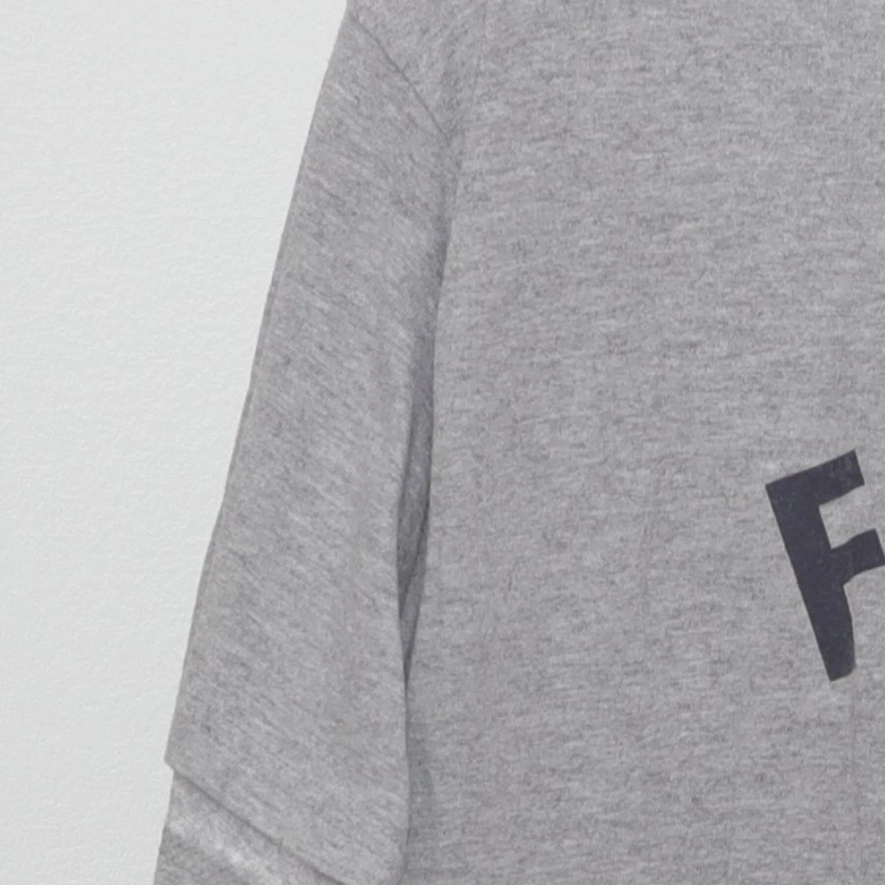 Close-up of the Left sleeve on the Vintage Y2K Champion "Football" T-Shirt - M