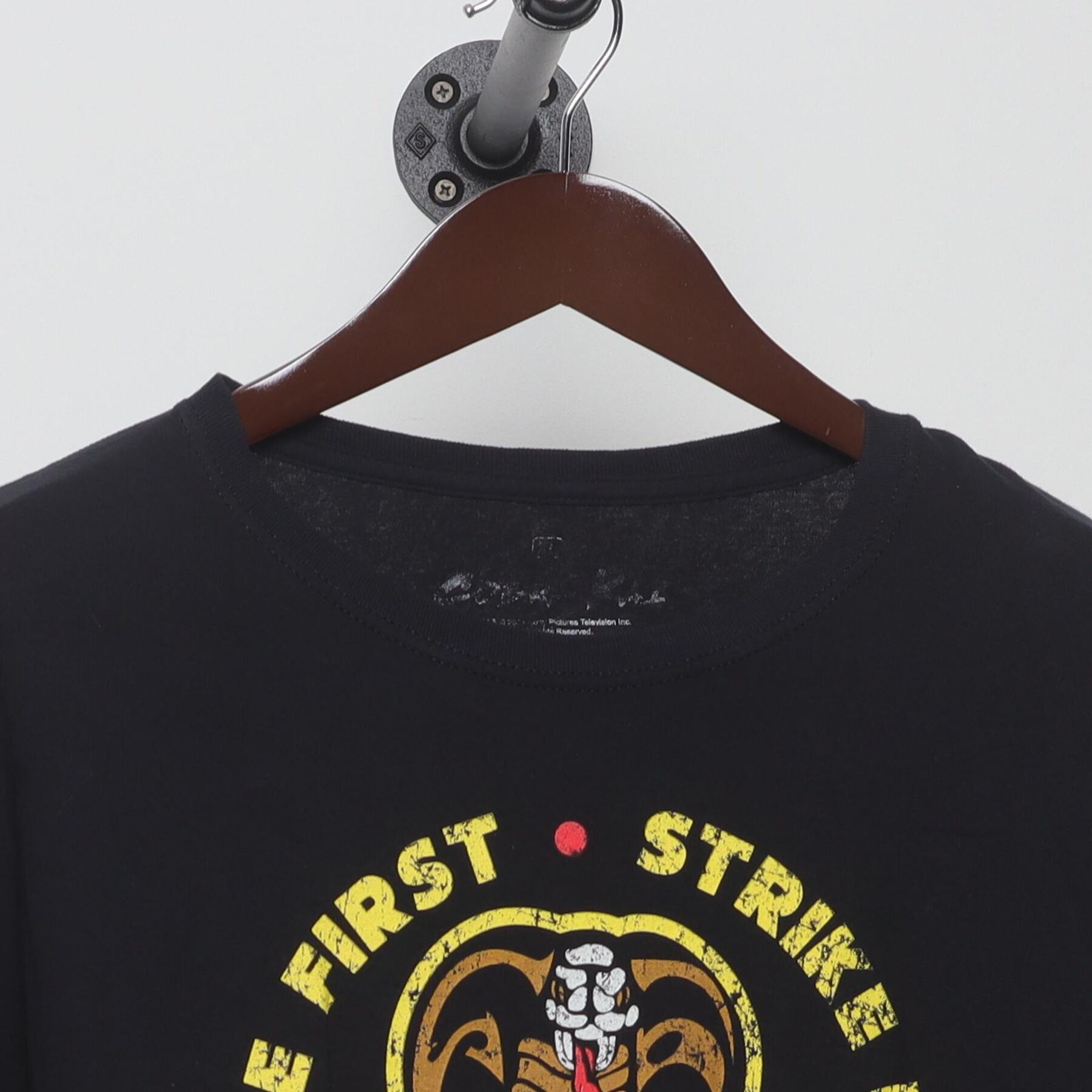 Close-up of the collar and tag on the Vintage Y2K Cobra Kai "Strike First Strike Hard No Mercy" T-Shirt - L