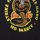 Close-up of the main graphic on the Vintage Y2K Cobra Kai "Strike First Strike Hard No Mercy" T-Shirt - L