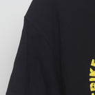 Close-up of the Left sleeve on the Vintage Y2K Cobra Kai "Strike First Strike Hard No Mercy" T-Shirt - L
