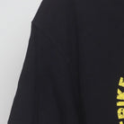 Close-up of the Left sleeve on the Vintage Y2K Cobra Kai "Strike First Strike Hard No Mercy" T-Shirt - L