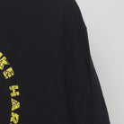 Close-up of the Right sleeve on the Vintage Y2K Cobra Kai "Strike First Strike Hard No Mercy" T-Shirt - L