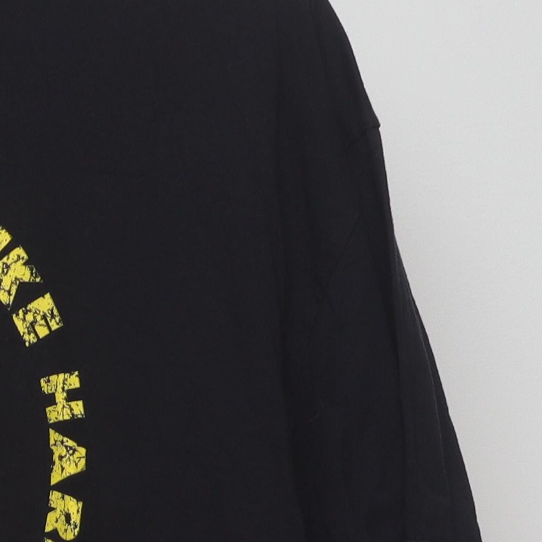 Close-up of the Right sleeve on the Vintage Y2K Cobra Kai "Strike First Strike Hard No Mercy" T-Shirt - L