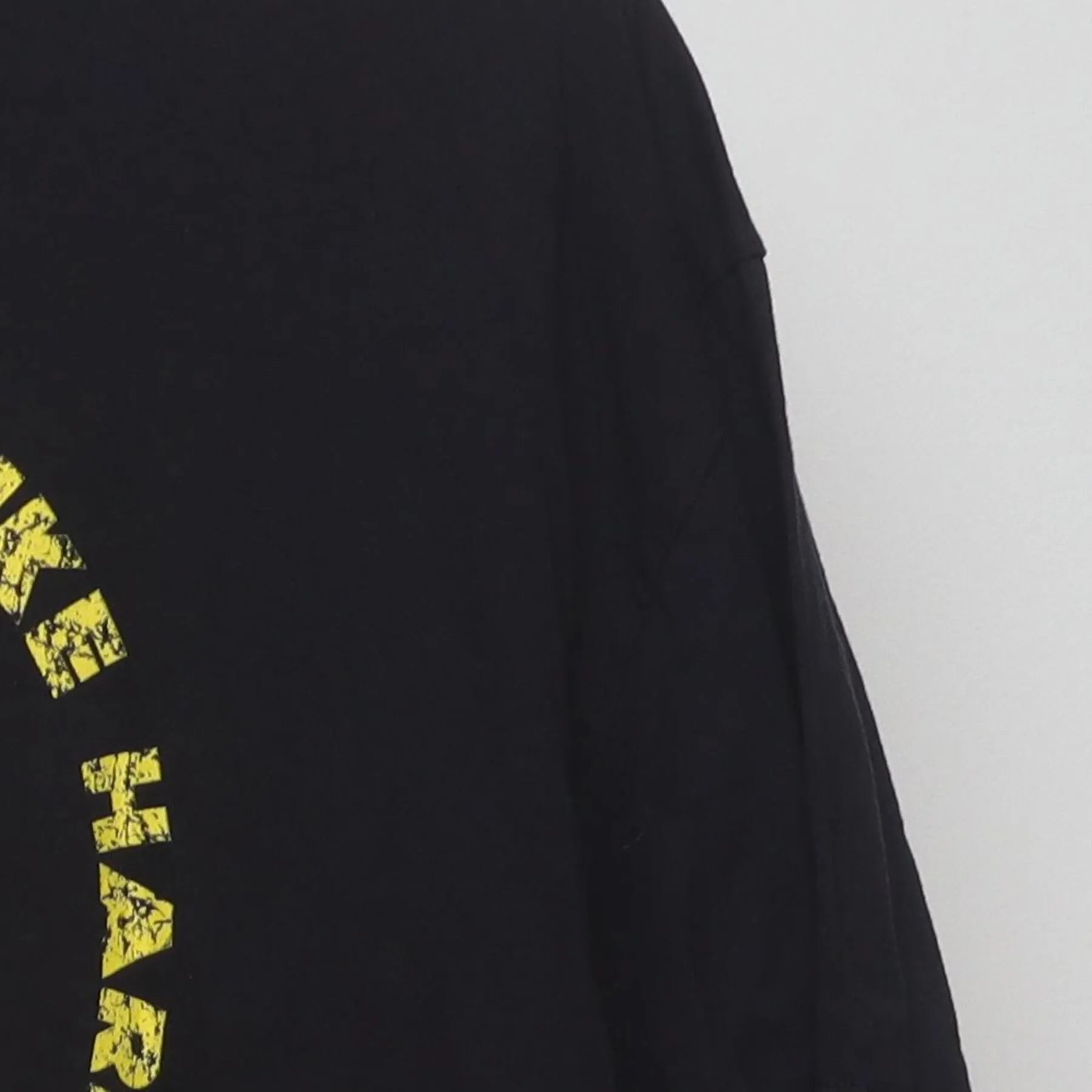 Close-up of the Right sleeve on the Vintage Y2K Cobra Kai "Strike First Strike Hard No Mercy" T-Shirt - L