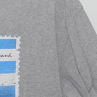 Close-up of the Right sleeve on the Vintage Y2K Royal Caribbean "Cuba Souvenir Stamp" T-Shirt - M