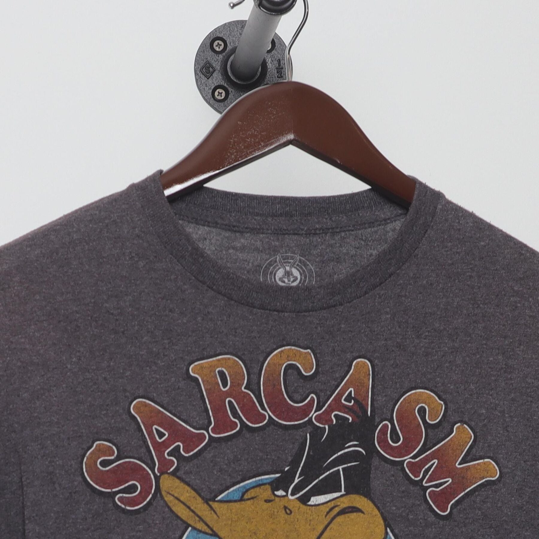 Close-up of the collar and tag on the Vintage 1990s Looney Tunes "Sarcasm Service" T-Shirt - S