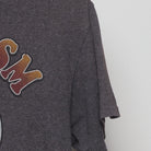 Close-up of the Right sleeve on the Vintage 1990s Looney Tunes "Sarcasm Service" T-Shirt - S