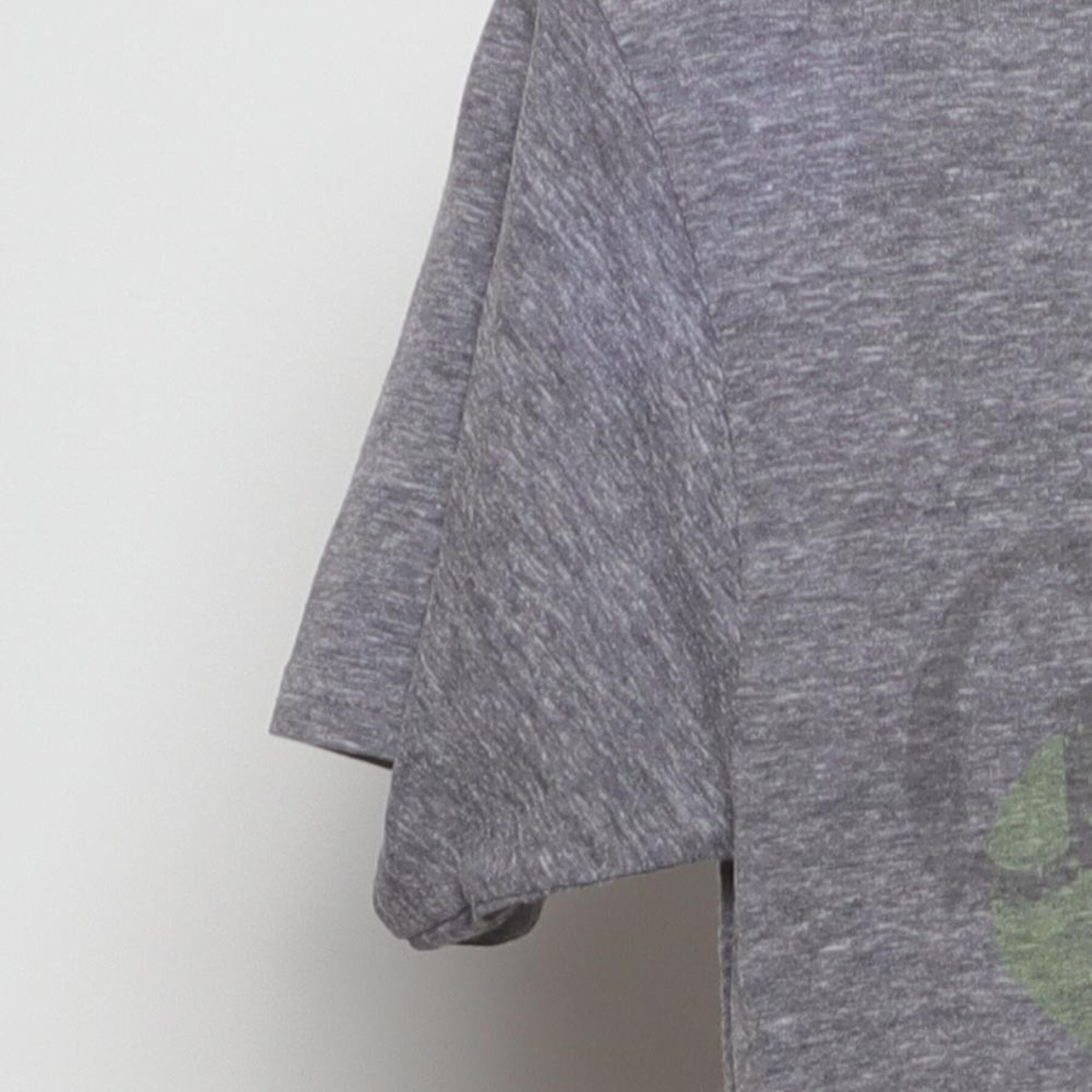 Close-up of the Left sleeve on the Vintage Y2K Guinness "Dublin Ireland Shamrock" T-Shirt - S