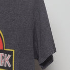 Close-up of the Right sleeve on the Vintage Y2K Jurassic Park "Classic Logo" T-Shirt - M