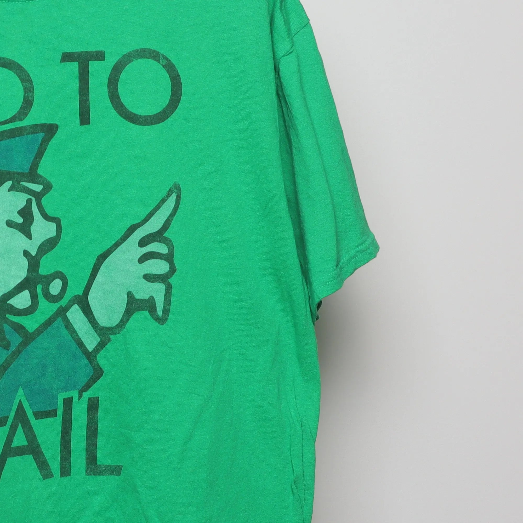 Close-up of the sleeve on the Vintage-Style Monopoly Go To Jail Graphic T-Shirt XL