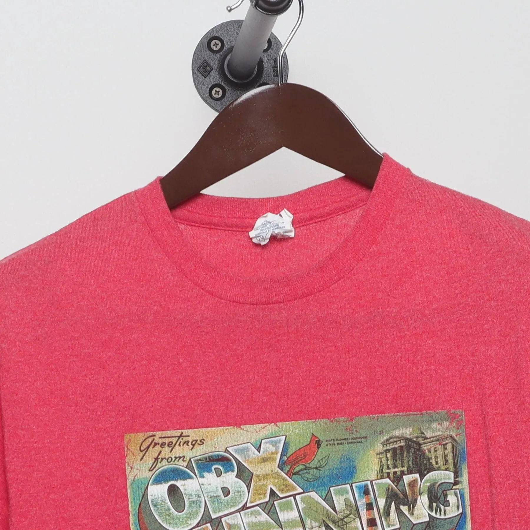 Close-up of the collar and tag on the Vintage Y2K OBX Running Company "Greetings from OBX" Postcard T-Shirt - S