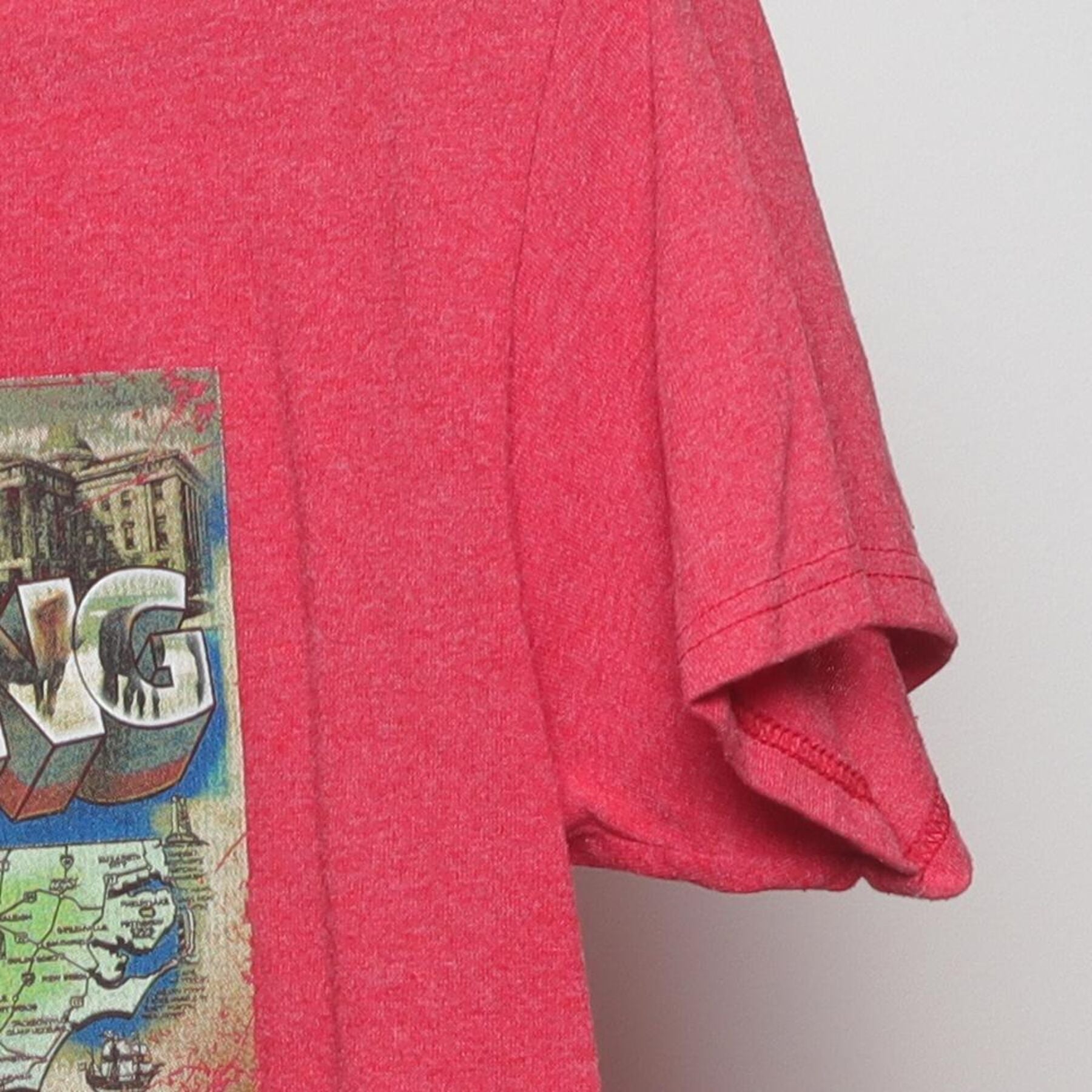 Close-up of the Right sleeve on the Vintage Y2K OBX Running Company "Greetings from OBX" Postcard T-Shirt - S