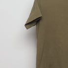 Close-up of the sleeve on the Vintage-Style Uniqlo UT Lion Coffee Graphic T-Shirt M