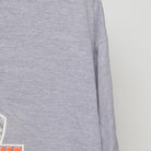 Close-up of the sleeve on the Vintage Y2K 2005 Orange Bowl "Oklahoma Sooners" T-Shirt - XL