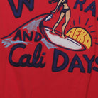 Close-up of the Right sleeve on the Vintage Y2K Aéropostale "Waves, Rays, and Cali Days" Surfer Graphic T-Shirt